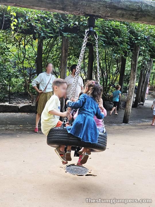 Making new friends on the tire swing.