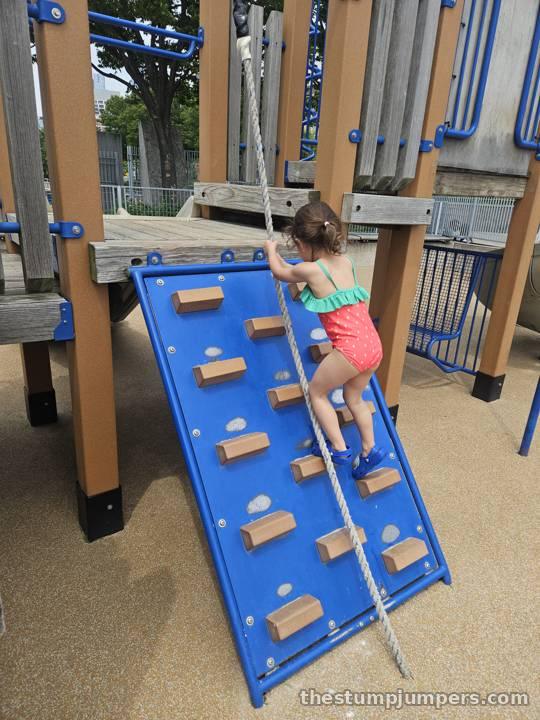 Scaling the climbing wall.