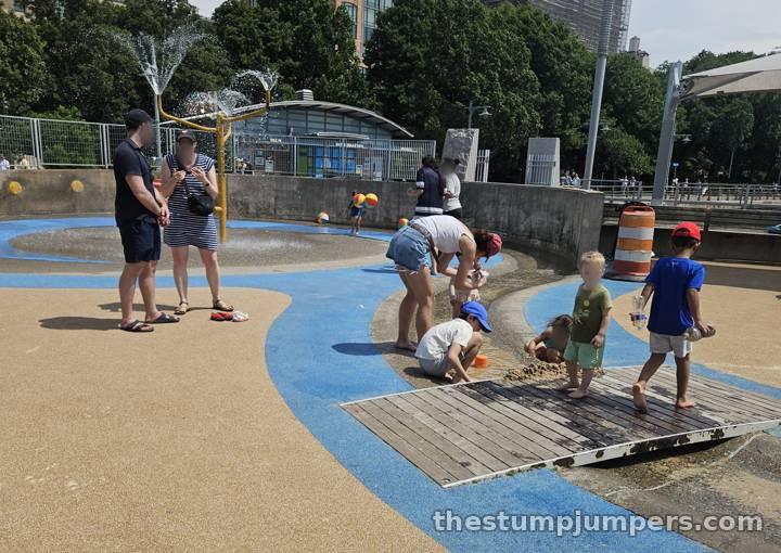 Damming up the stream with sand.